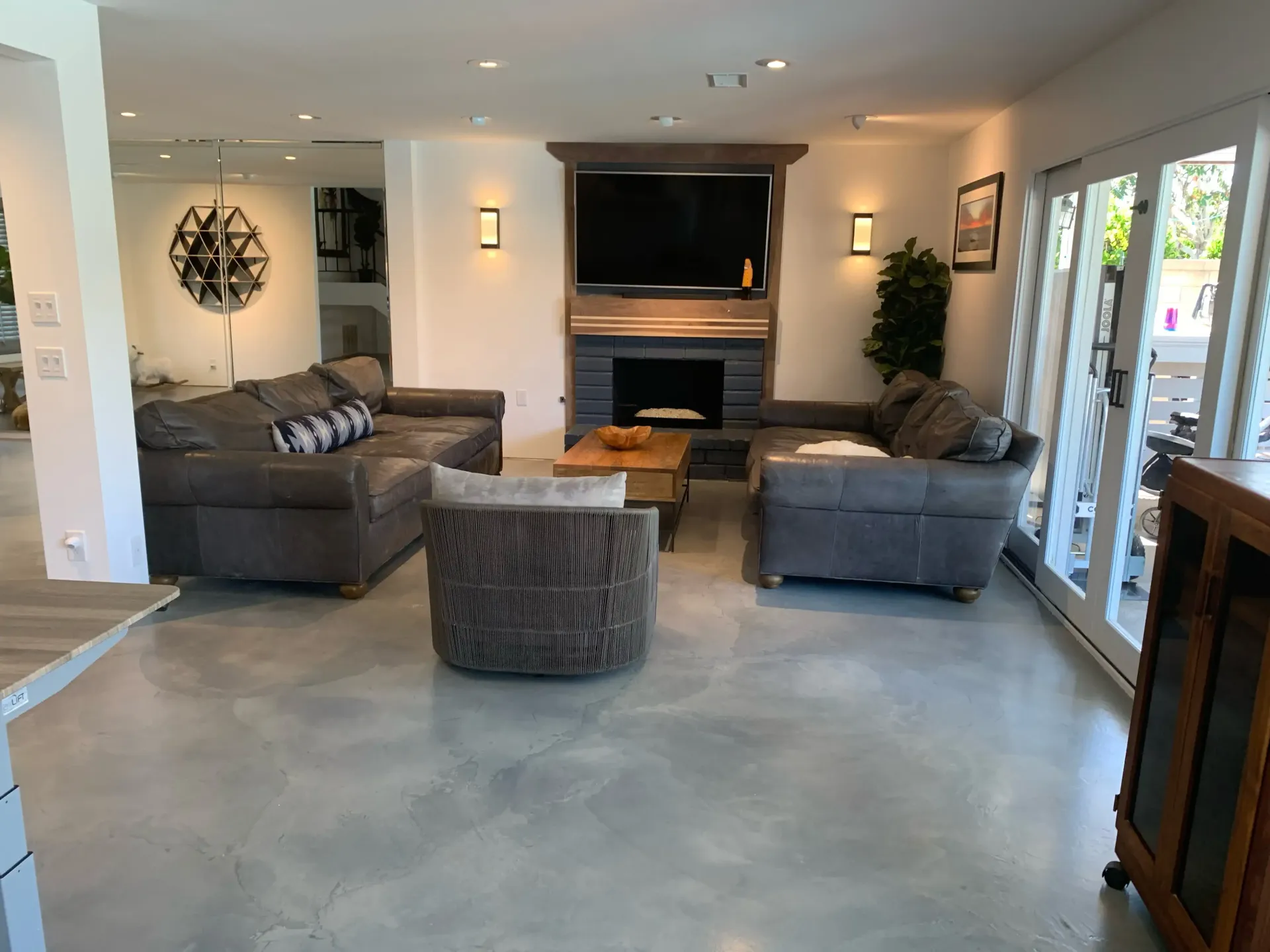 A living room filled with furniture and a fireplace