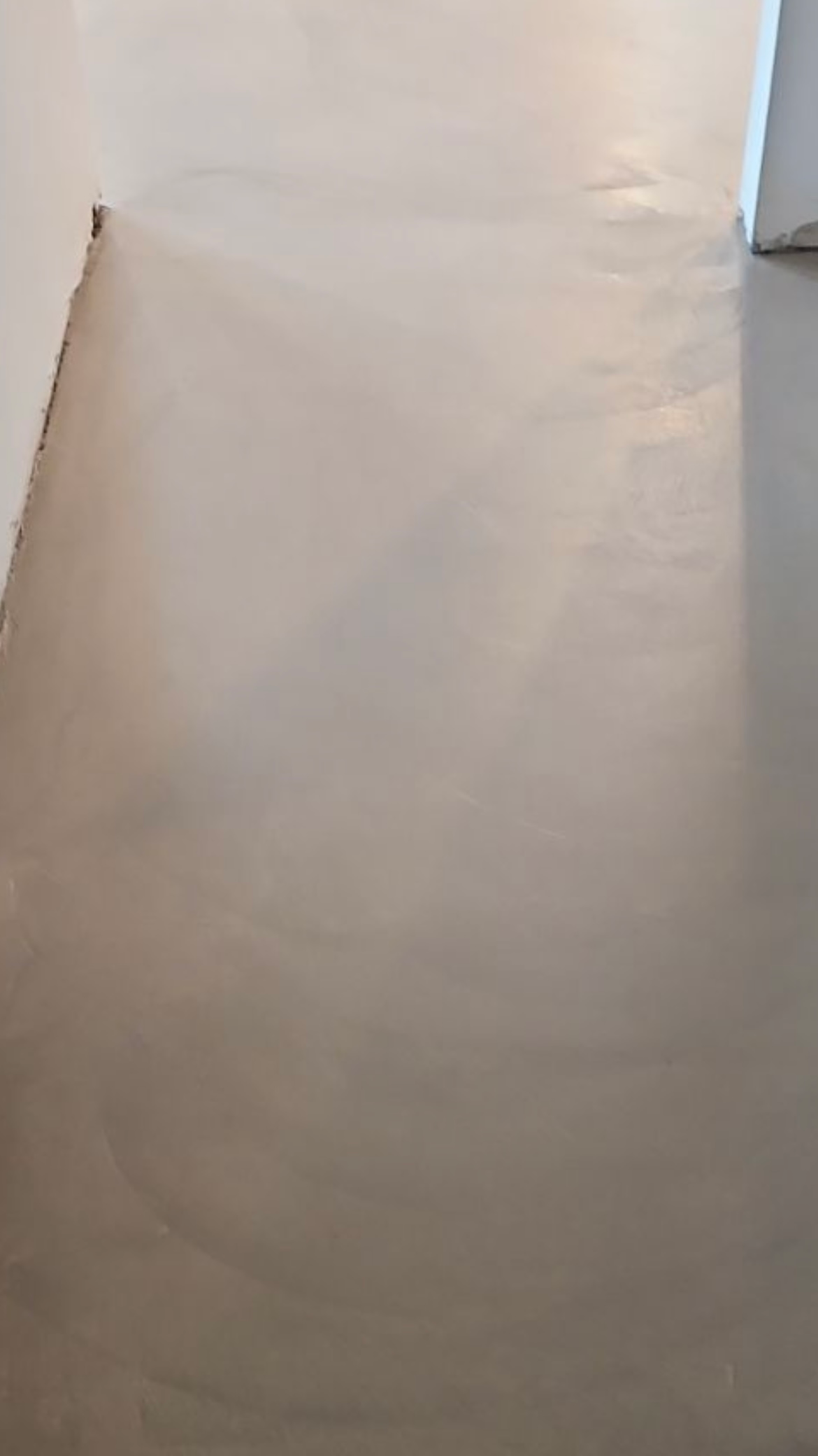 A close up of a concrete floor in a room.