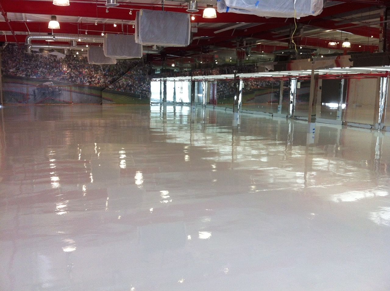 A large room with a white floor and red ceiling