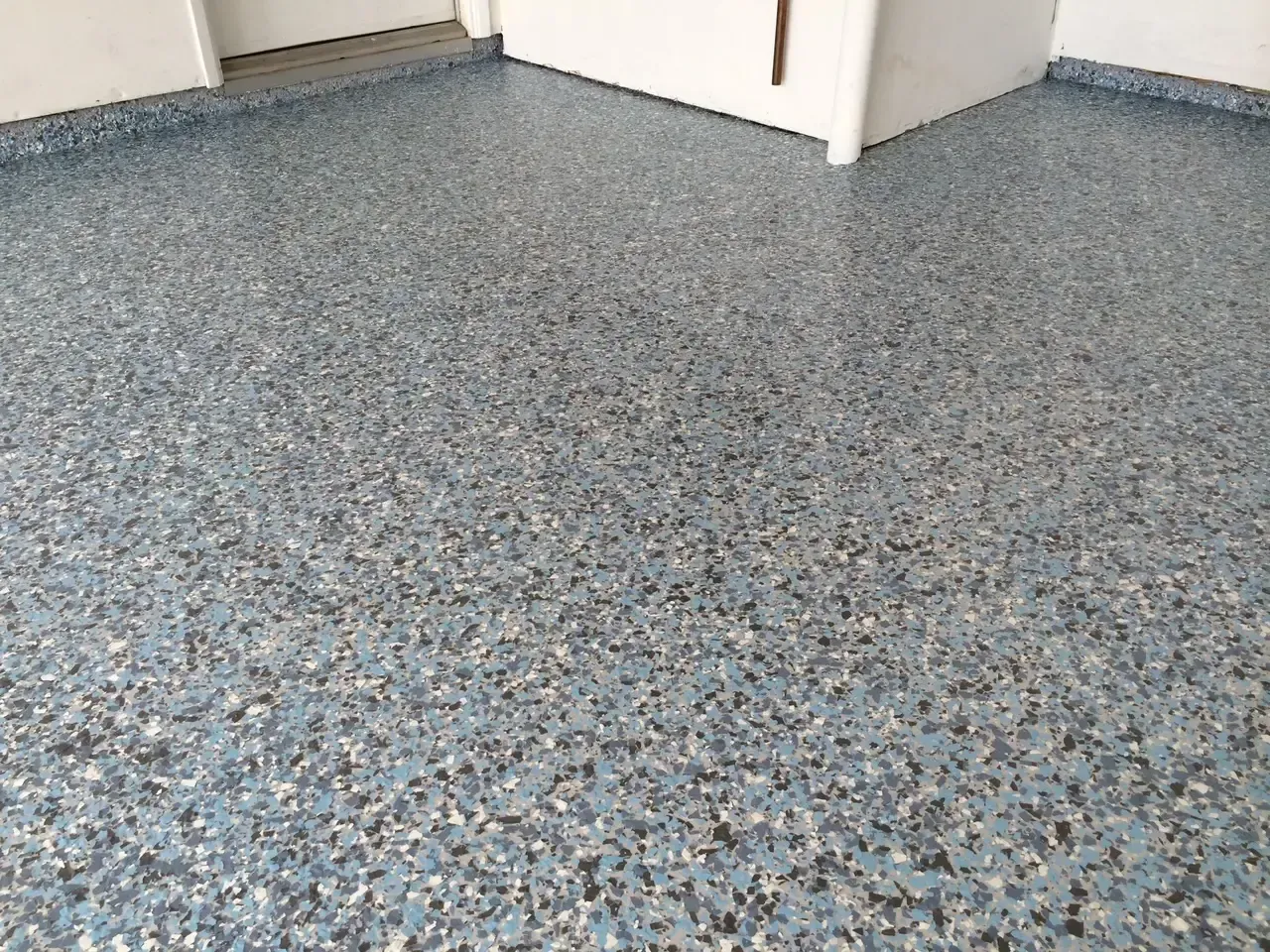 A close up of a blue floor in a room.