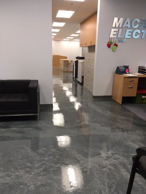 A room with a sign that says mac electronics