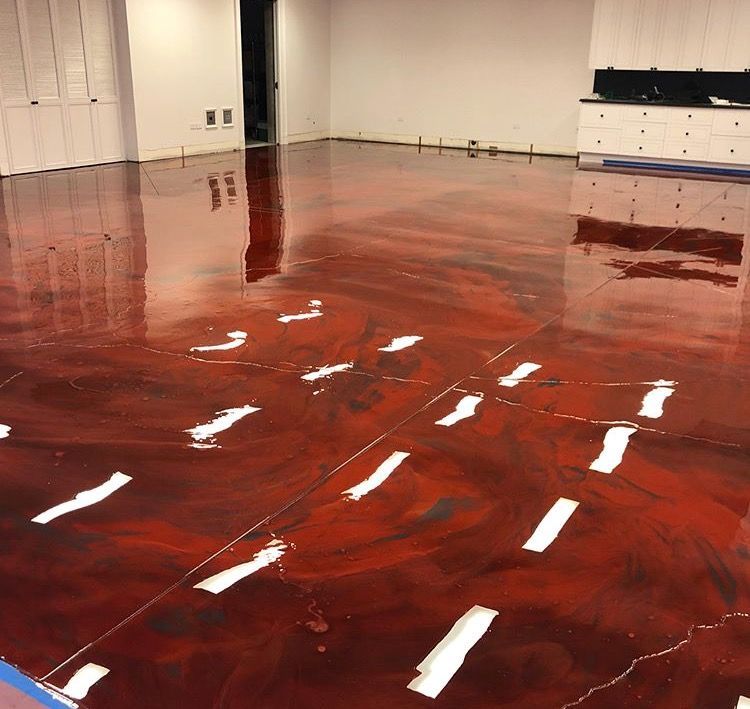 A room with a red floor and white lines on it