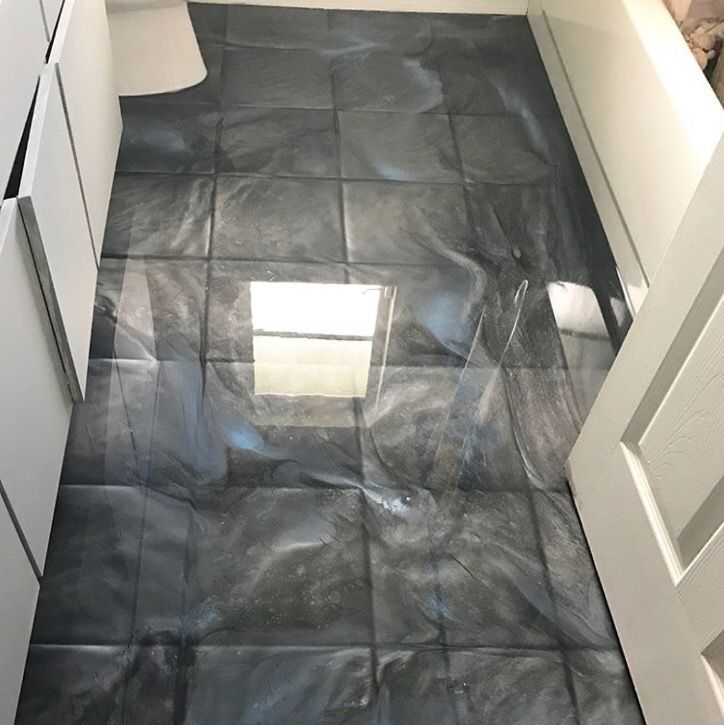 A tiled floor with a light shining through it