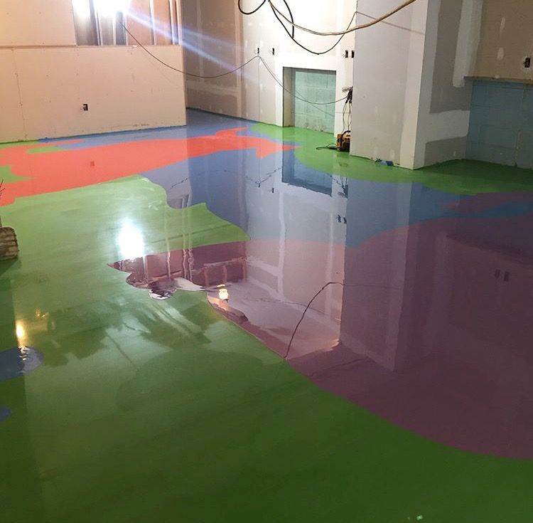 A room with a rainbow of colors on the floor