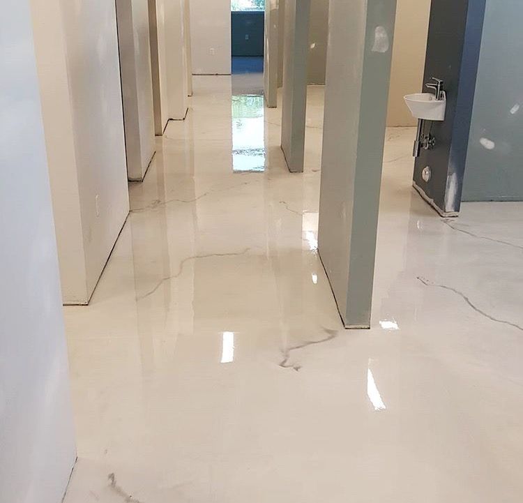 There is a sink in the middle of the hallway.