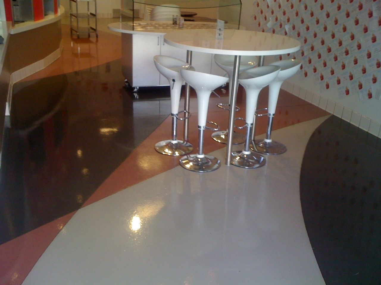 A room with a table and chairs in it