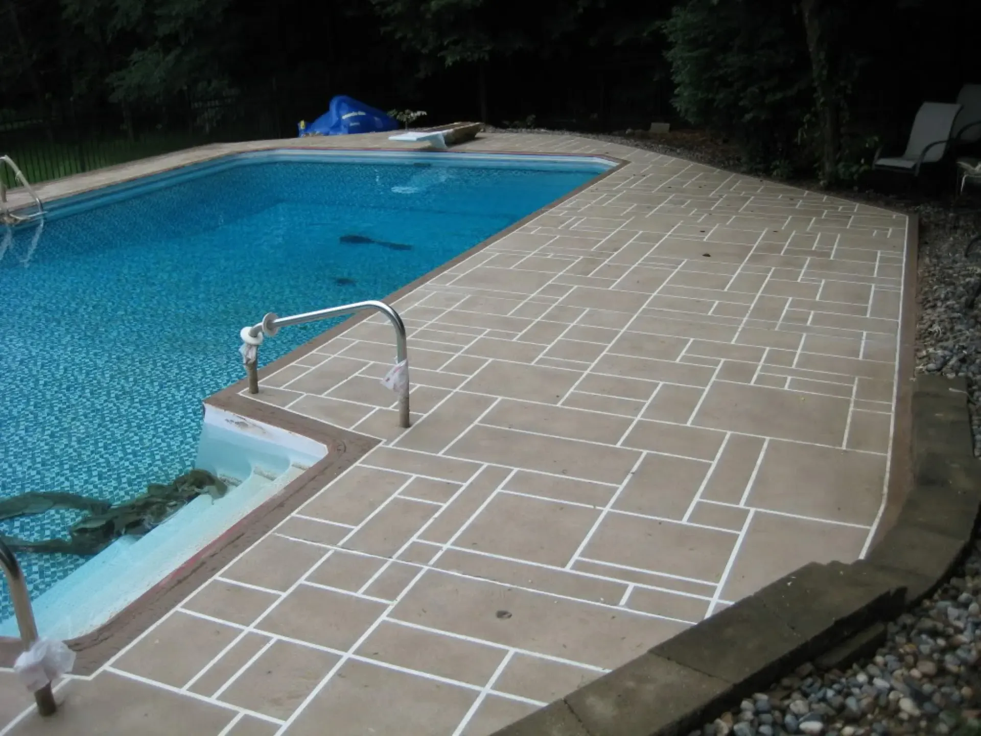 A swimming pool with a staircase leading to it