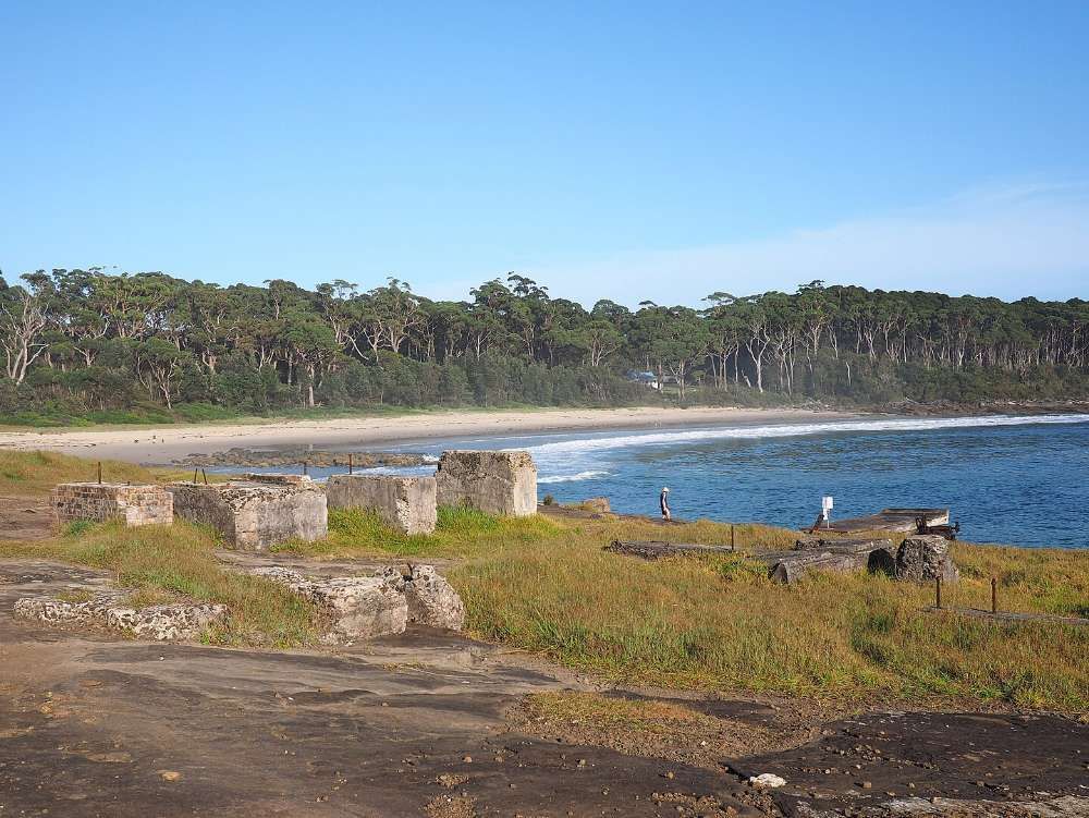 A Large Body Of Water With A Beach In The Background — BayCoast Electrical & Control Solutions in Bawley Point, NSW