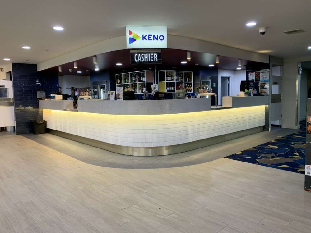 A Restaurant With A Long Counter And A Sign That Says Keno On It — BayCoast Electrical & Control Solutions in Bawley Point, NSW