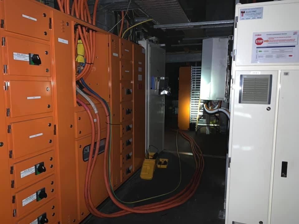 A Room With A Lot Of Orange Electrical Boxes And Wires — BayCoast Electrical & Control Solutions In Nelligen, NSW