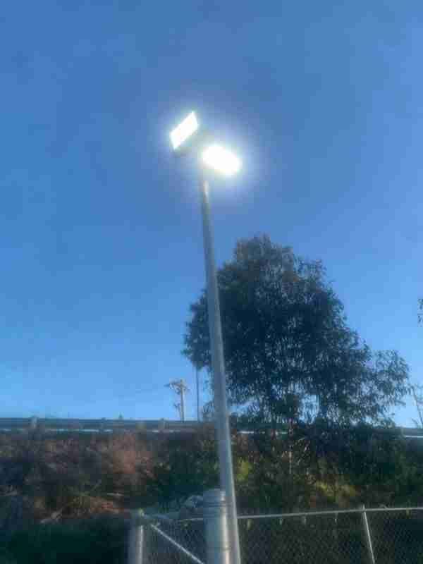 A Street Light Is Lit up In the Middle of A Park — Bay Coast Electrical & Control Solutions in Maloneys Beach, NSW