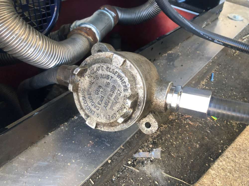 A Hose Is Attached To A Metal Box That Says ' U.s. Electrical Supply Co ' On It — BayCoast Electrical & Control Solutions In South Durras, NSW