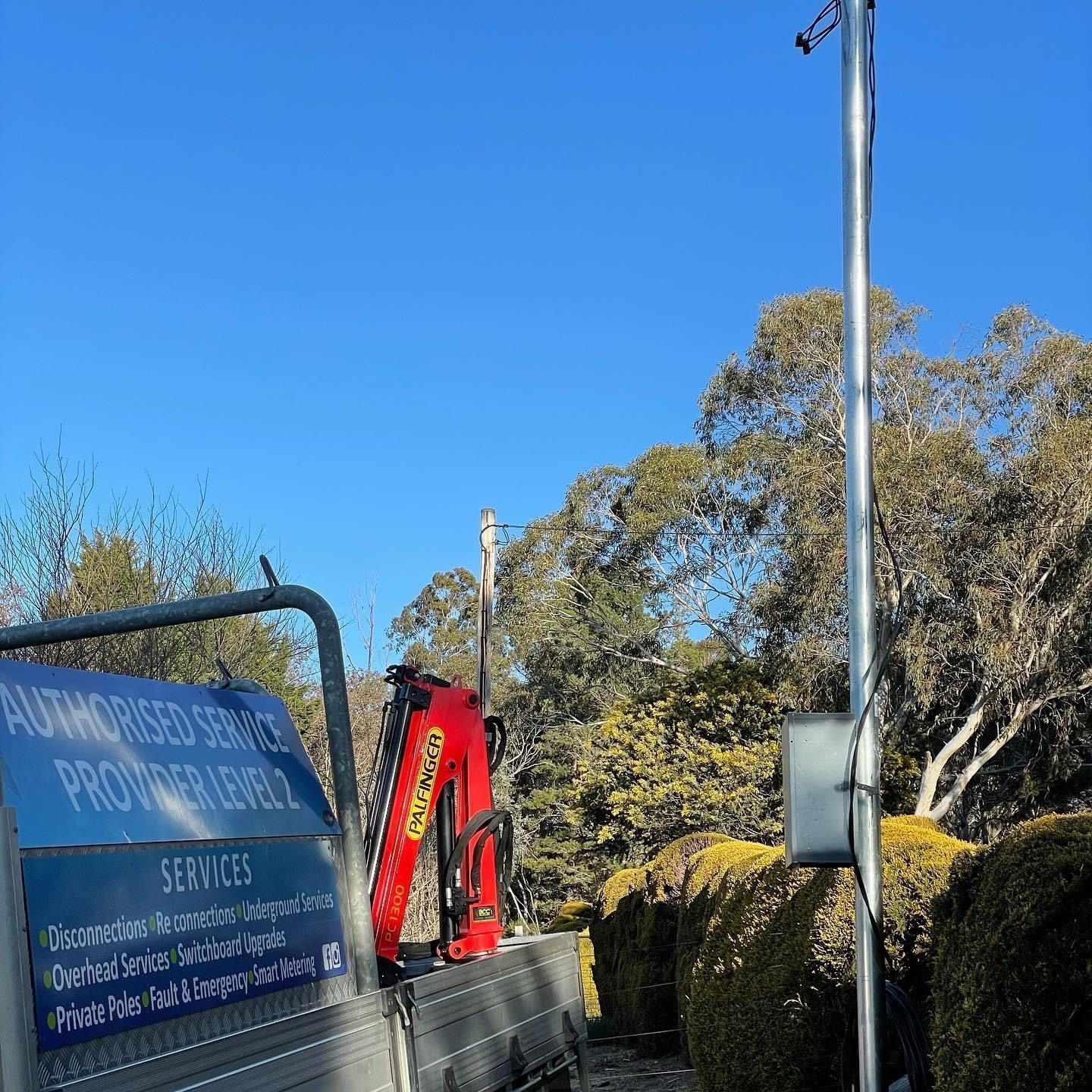 A Ladder Is Hanging From The Roof Of A House — BayCoast Electrical & Control Solutions in Maloneys Beach, NSW