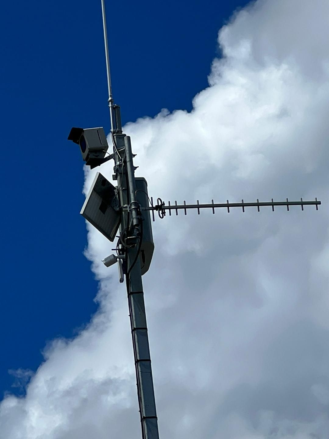A Very Tall Antenna With A Blue Sky In The Background — BayCoast Electrical & Control Solutions in Braidwood, NSW