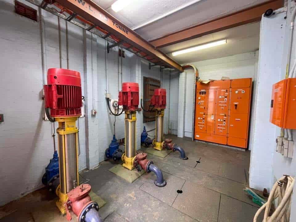 A Room Filled with Lots of Pumps and Electrical Equipment — Bay Coast Electrical & Control Solutions in Maloneys Beach, NSW