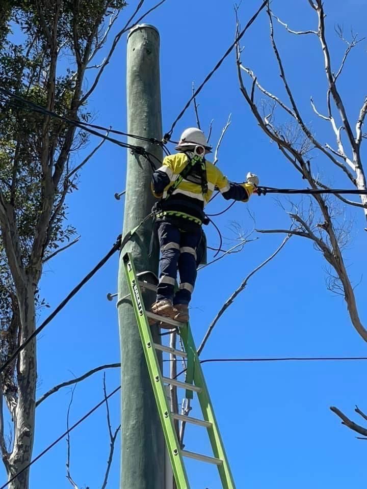 A Rusty Pipe Is Sitting On Top Of A Blue Spool — BayCoast Electrical & Control Solutions in Maloneys Beach, NSW