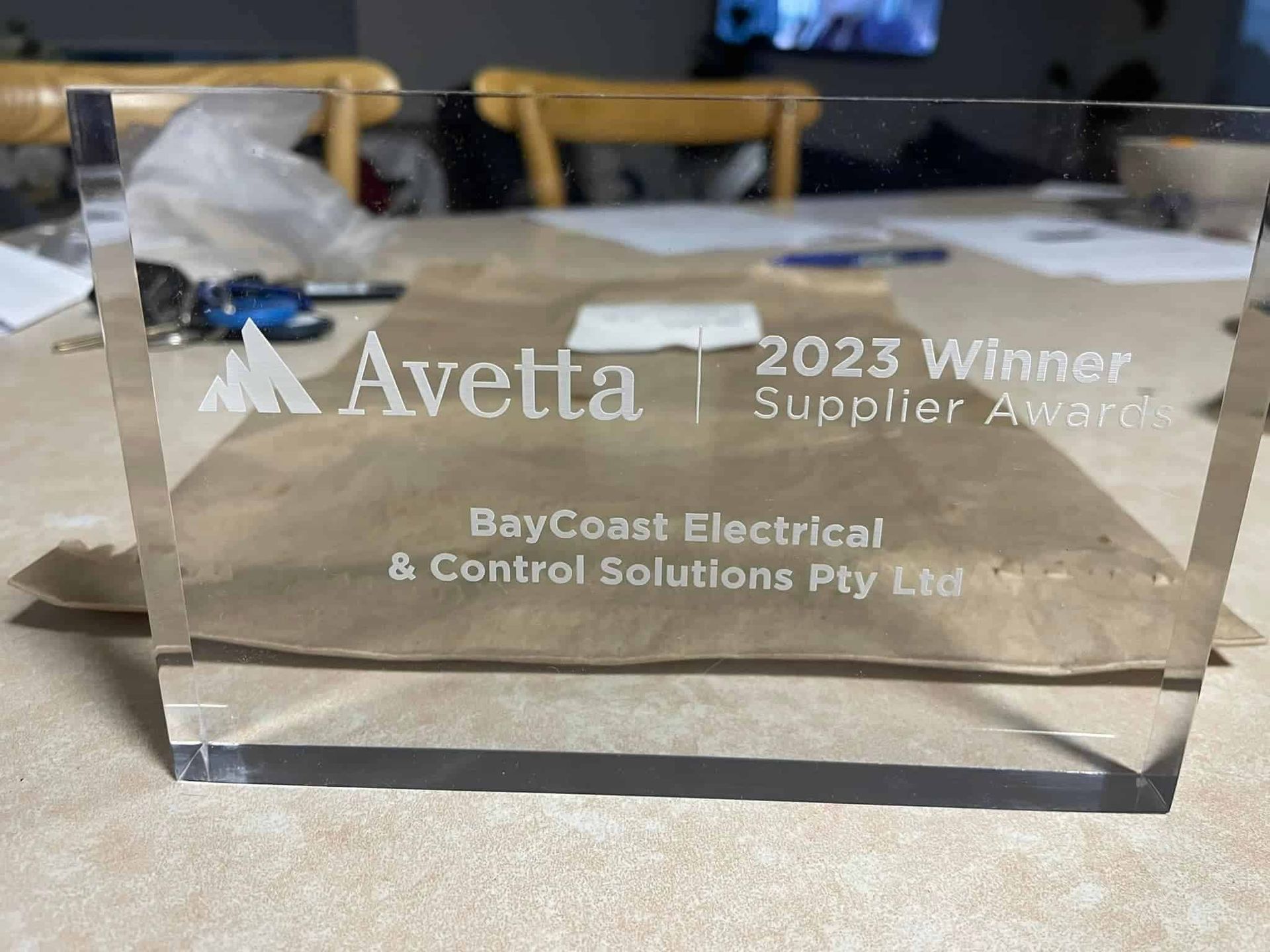 A Clear Acrylic Plaque That Says Avetta On It Is Sitting On A Table — BayCoast Electrical & Control Solutions in Maloneys Beach, NSW