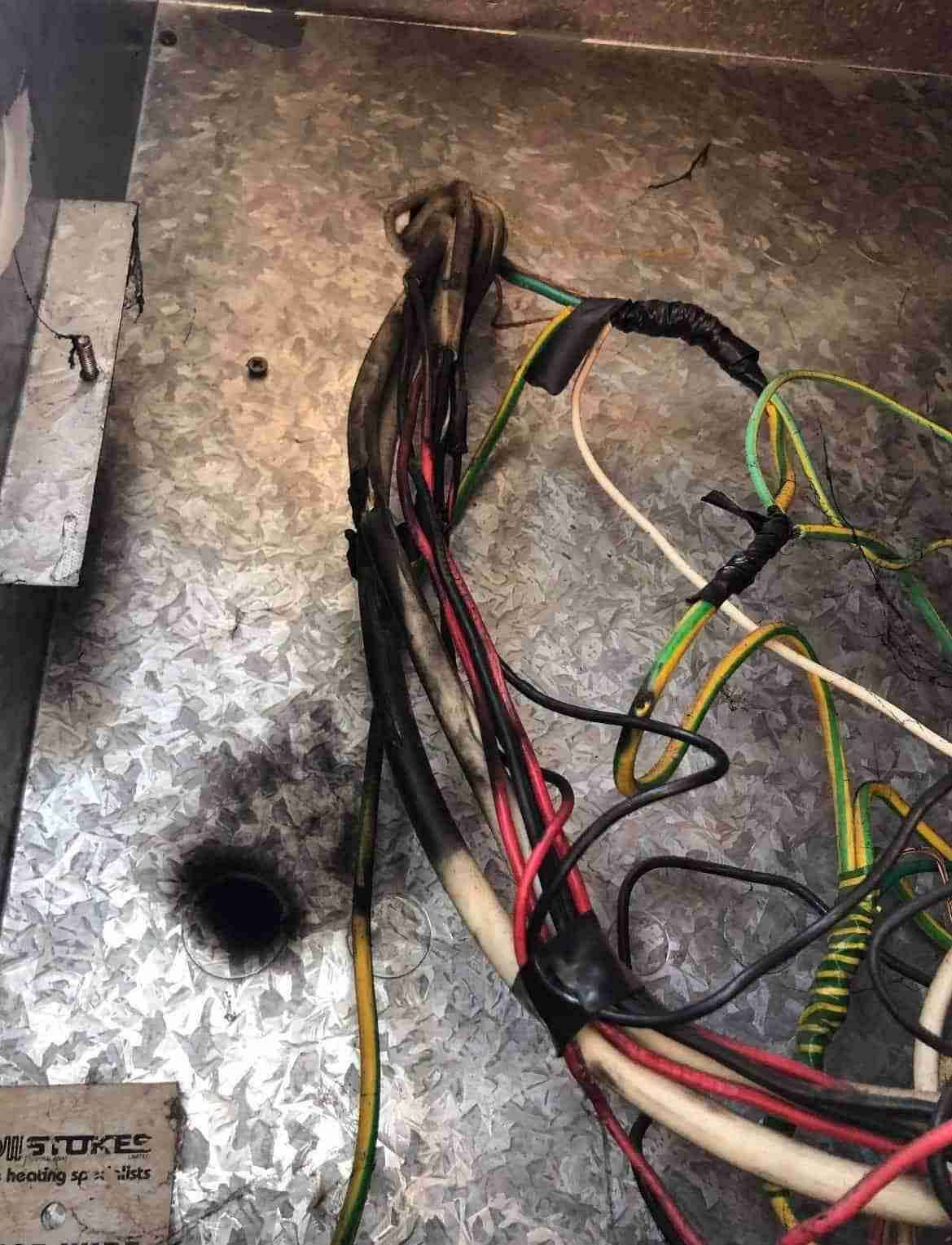 A Bunch of Wires Are Laying on A Metal Surface — Bay Coast Electrical & Control Solutions in Maloneys Beach, NSW