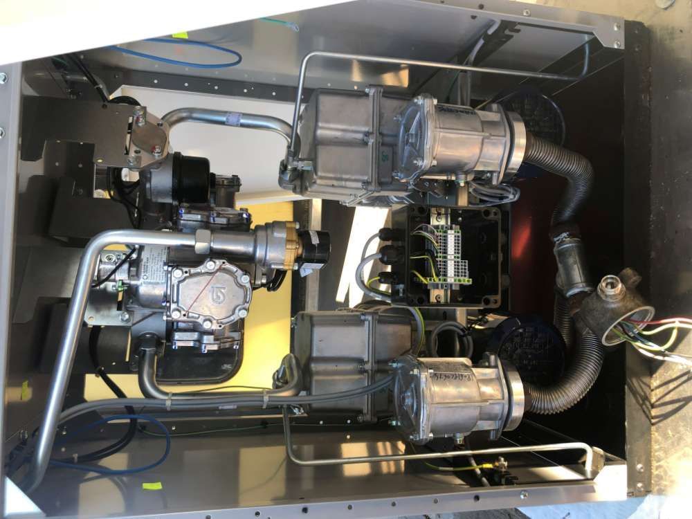 The Inside Of A Machine With A Lot Of Pipes Coming Out Of It — BayCoast Electrical & Control Solutions In Broulee, NSW