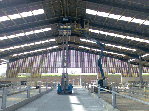 A Large Building With A Roof That Has A Lot Of Windows — BayCoast Electrical & Control Solutions In South Durras, NSW