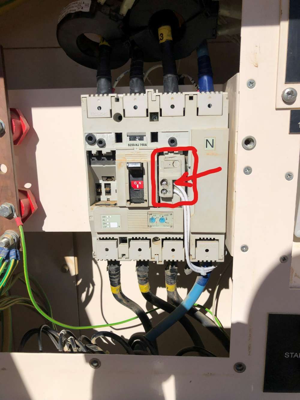 A Electrical Box With A Red Arrow Pointing To A Breaker — BayCoast Electrical & Control Solutions In South Durras, NSW