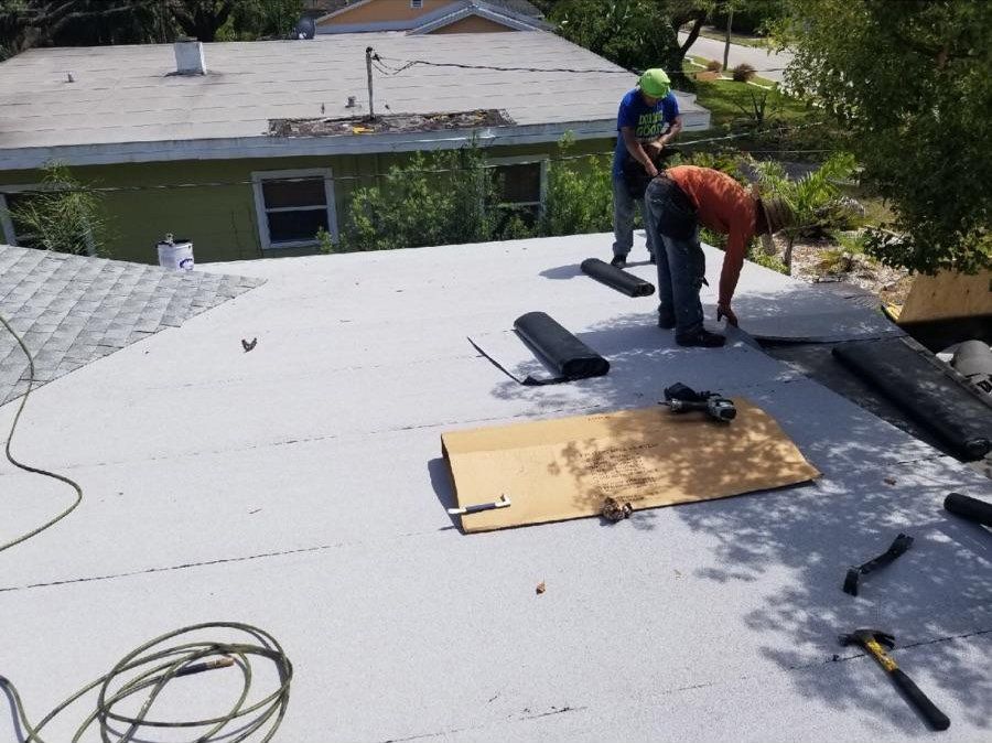 Man Installing A New Roof — AM Roofing & Waterproofing — Tampa, FL