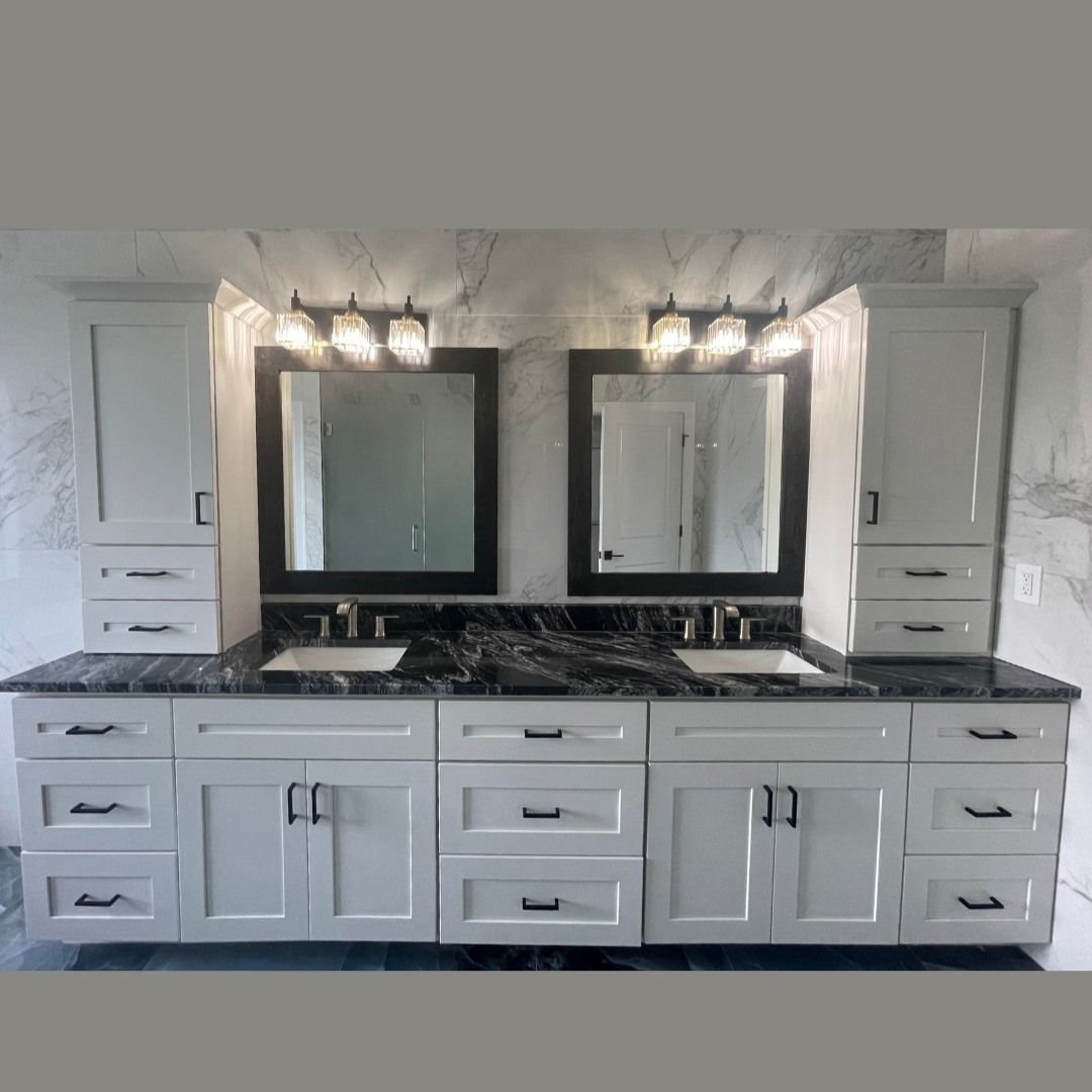 A bathroom with two sinks and two mirrors.