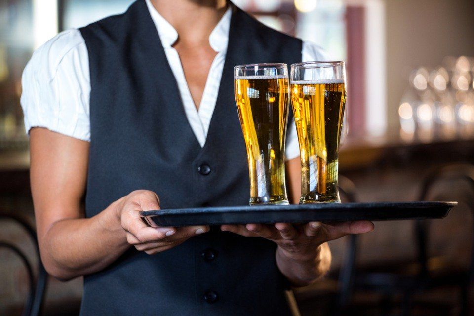 waitress serving drinks