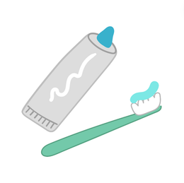 A tube of toothpaste and a toothbrush with toothpaste on it.