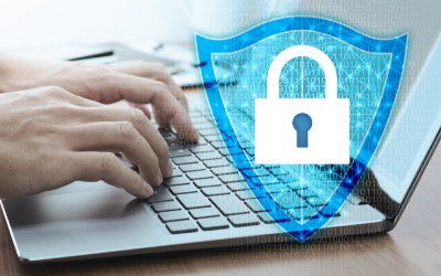 Hands typing on a laptop keyboard, overlaid with a glowing blue digital shield icon and a white padlock symbol.