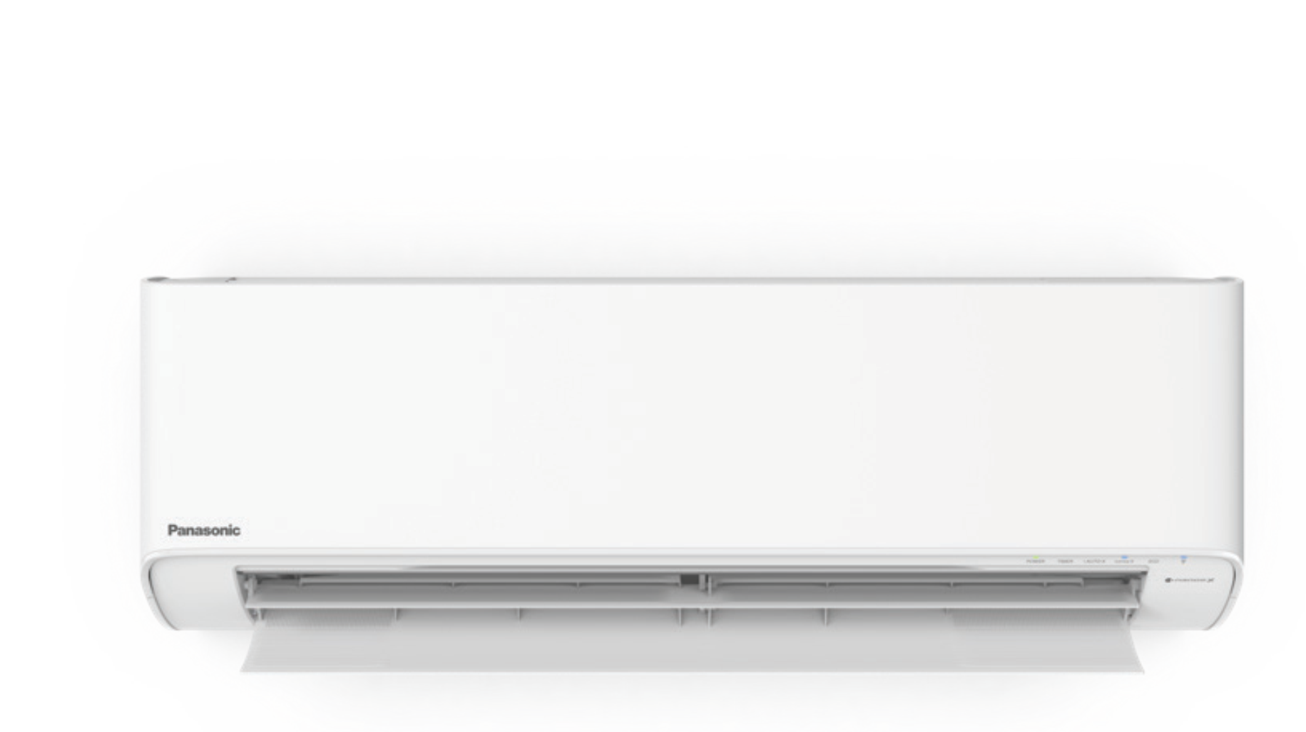 a white air conditioner is sitting on a white surface .
