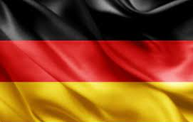 a close up of a german flag waving in the wind .