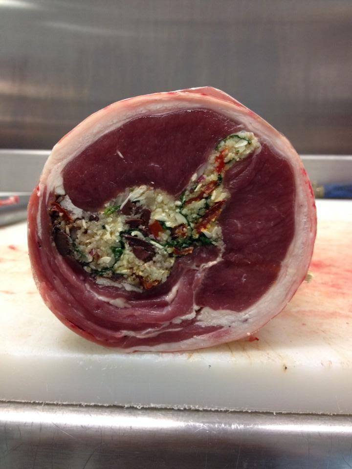 A Piece Of Meat Is Sitting On A White Cutting Board — Edgeworth Meat & More in Edgeworth, NSW