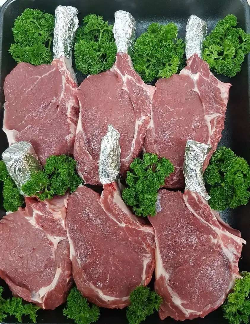 A Black Tray Filled With Raw Meat And Greens — Edgeworth Meat & More in Edgeworth, NSW