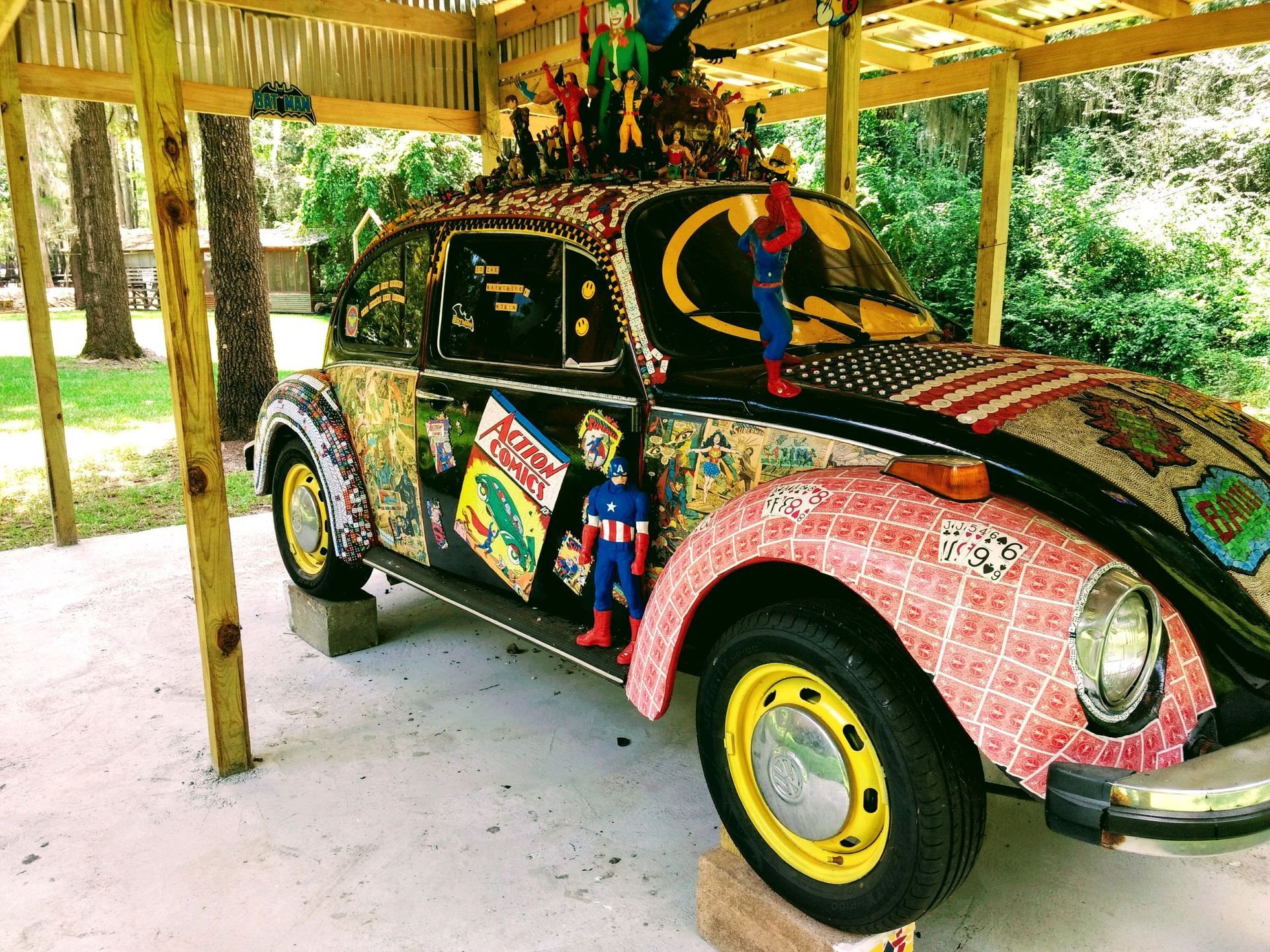 A car that has a superhero on top of it