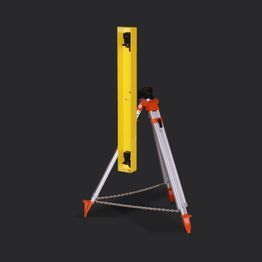 Un niveau jaune est posé sur un trépied.