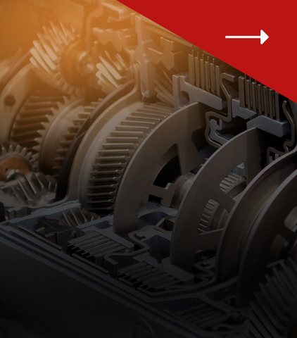 A cross-section view of complex mechanical gears and metal components inside an industrial transmission system.