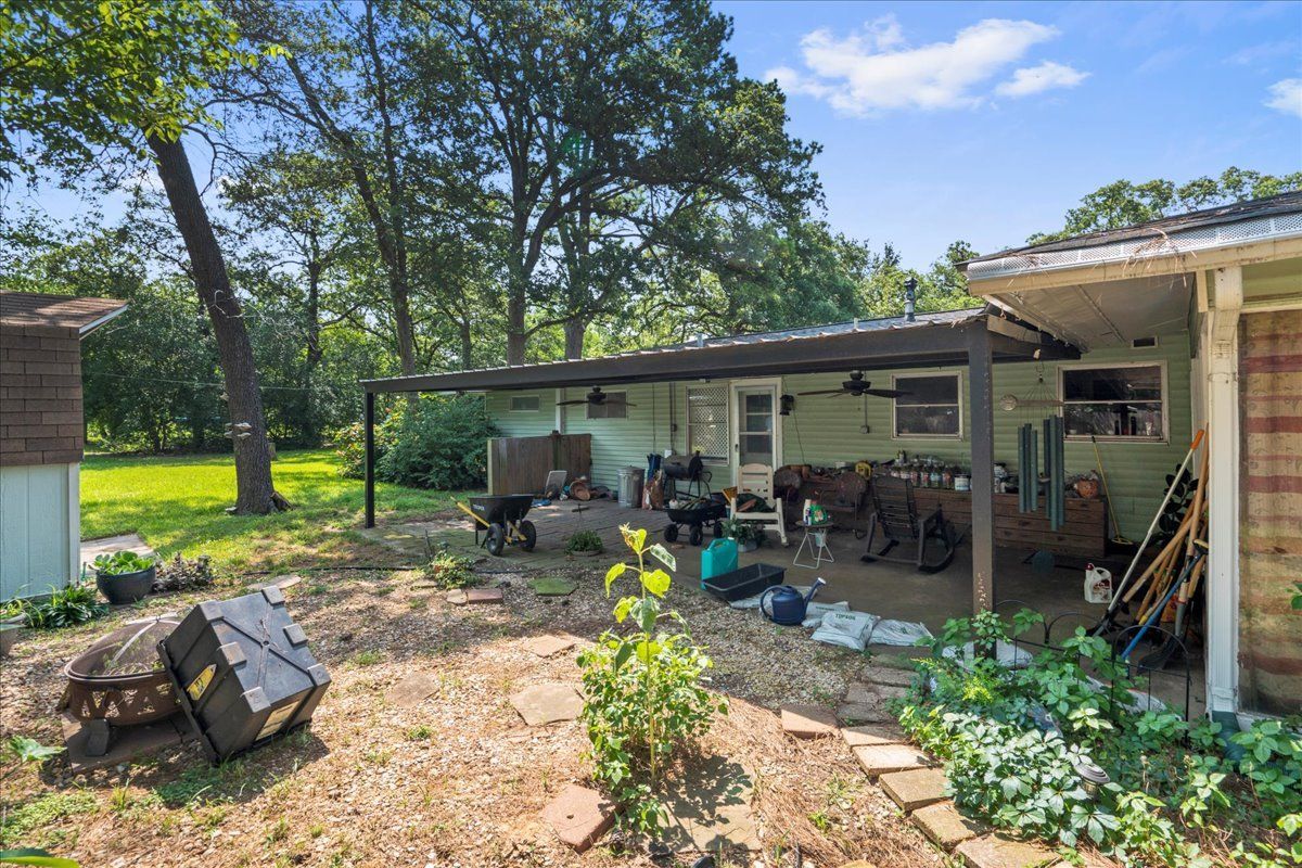 House with Garage and Trees — Rockdale, TX — Carol Matous - Jim Currey Realty