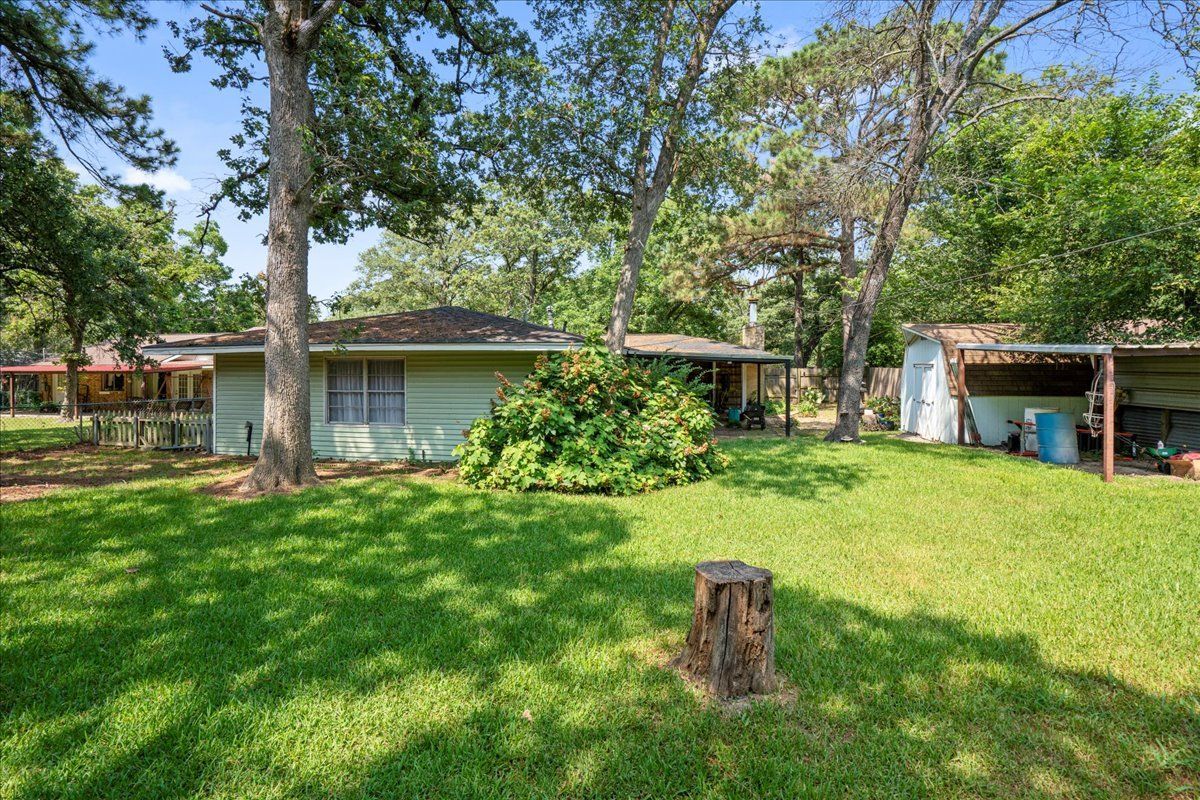 House with Cut Tree — Rockdale, TX — Carol Matous - Jim Currey Realty