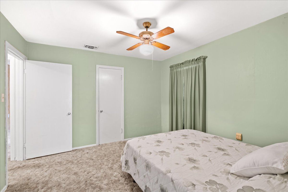 Bedroom with Green Wall — Rockdale, TX — Carol Matous - Jim Currey Realty