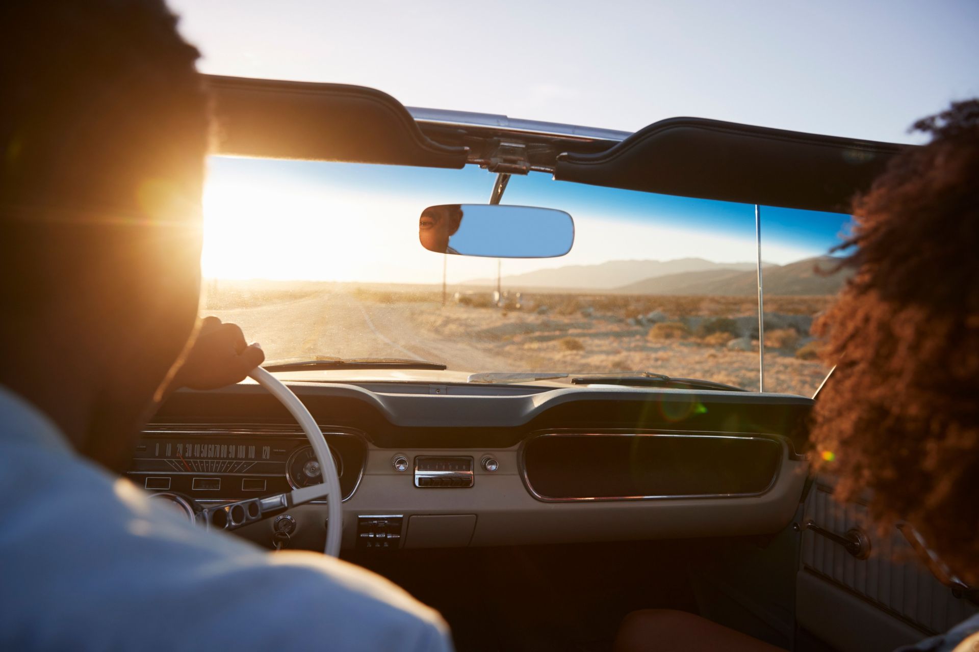 Texas driver reviewing SR-22 insurance certificate and car keys on desk - SR-22 filing requirements in Texas