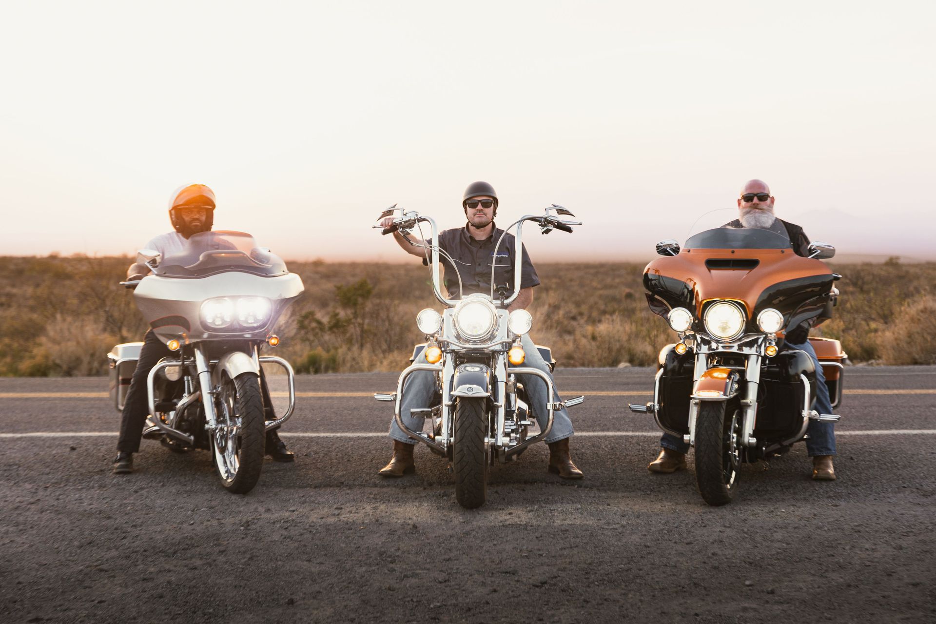 Motorcyclists riding together on a sunlit Texas highway, the everyday risk motorcycle insurance is b