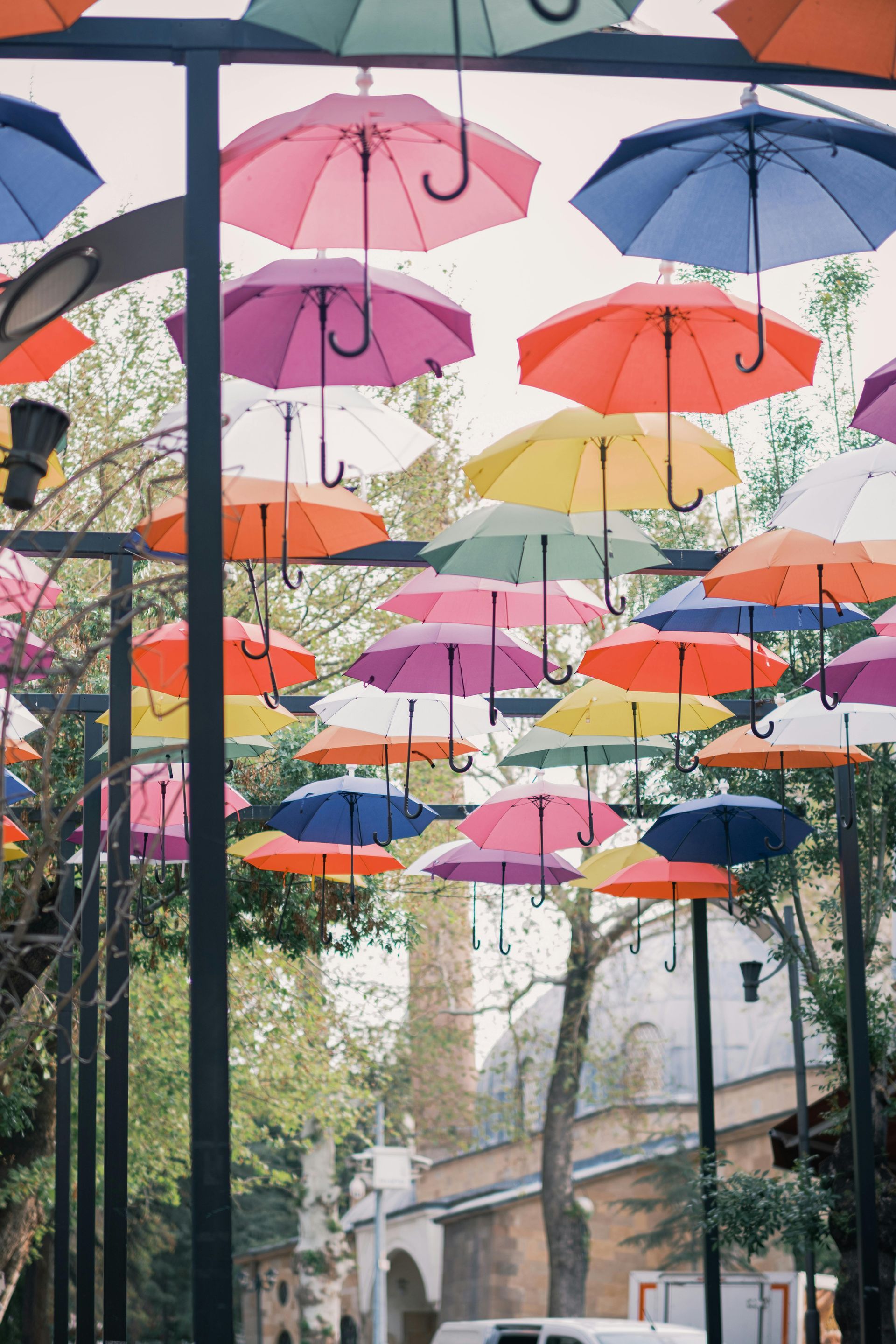 Texas family protecting assets with umbrella during storm, representing liability protection
