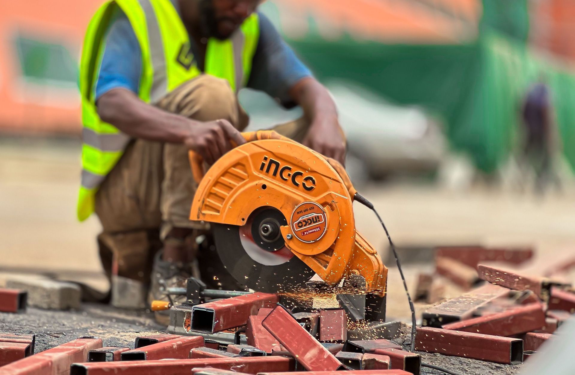 Texas contractor in a hi-vis vest using a circular saw on a job site, gear that tools and equipment insurance protects