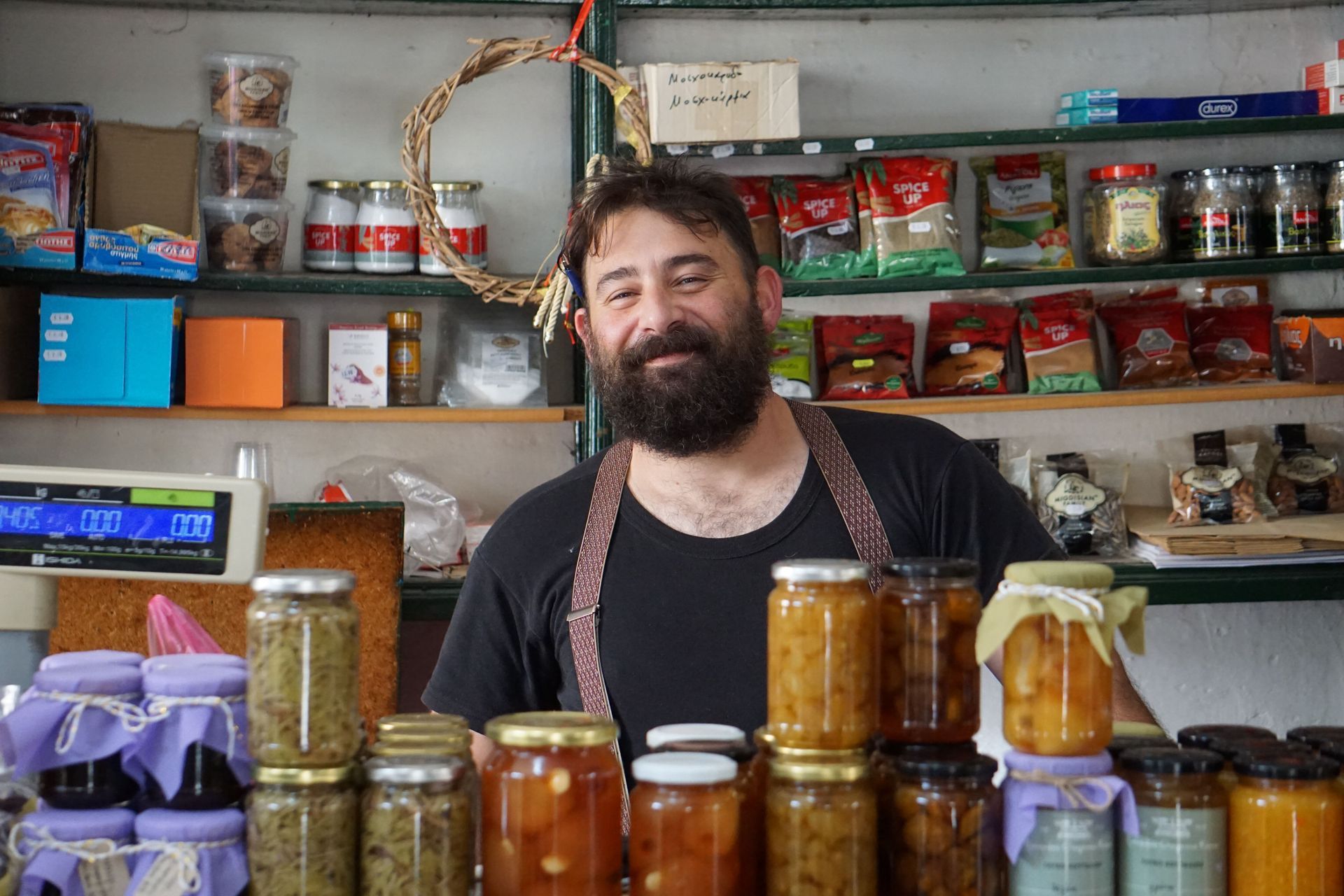 Texas small business owner standing in his stocked shop, the kind of business that needs general liability insurance coverage