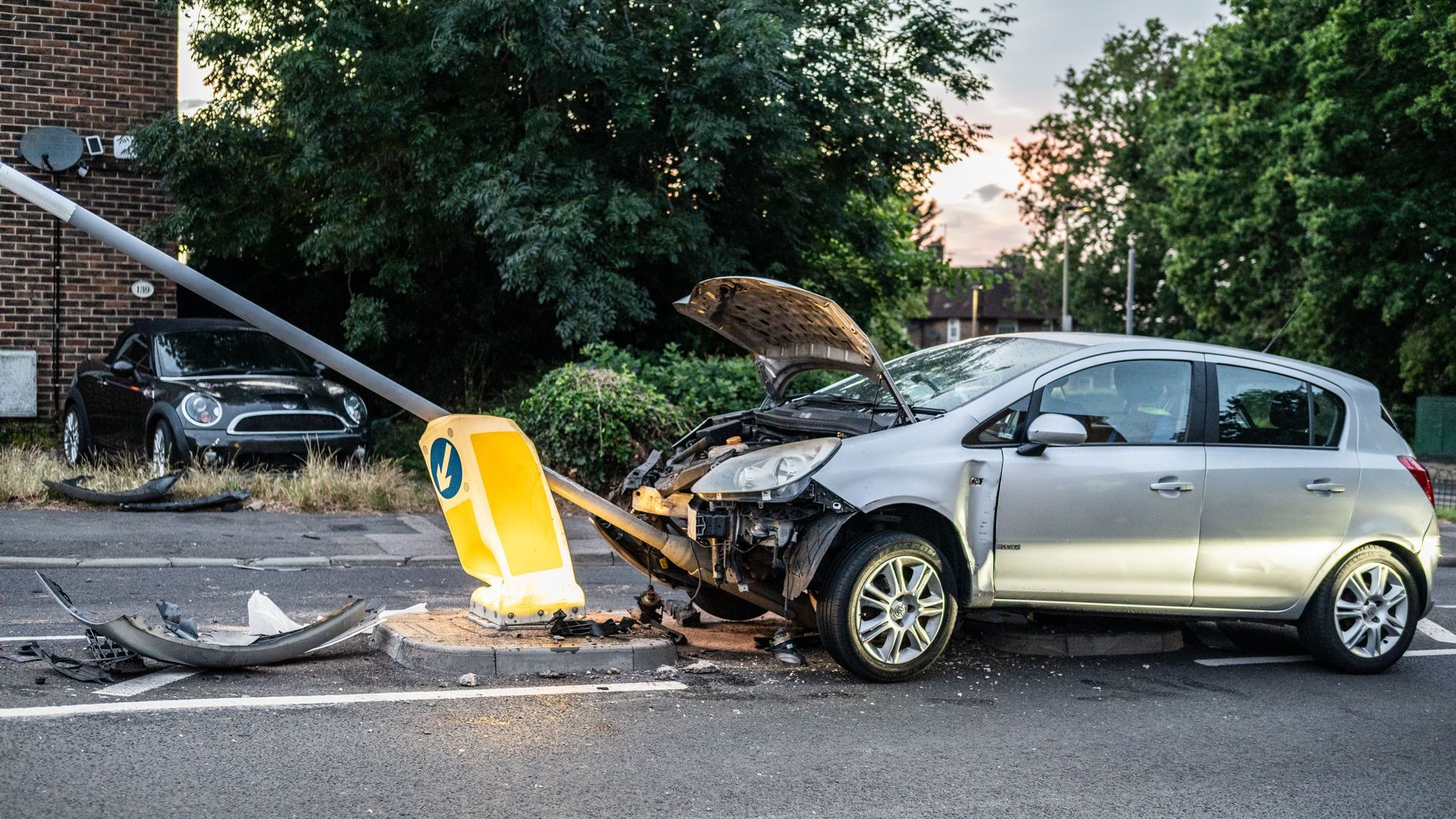 Damaged car and roadside warning triangle after a Texas car accident on a DFW street, illustrating w
