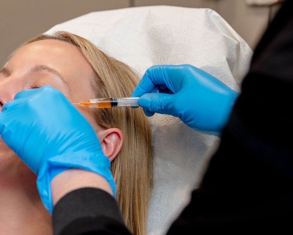 A woman is getting an injection in her eye