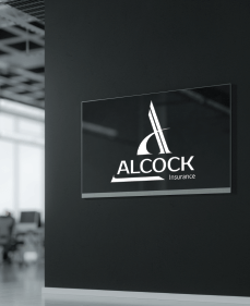 A sign for Alcock Insurance on a black wall with a blurred office background. White logo and text.