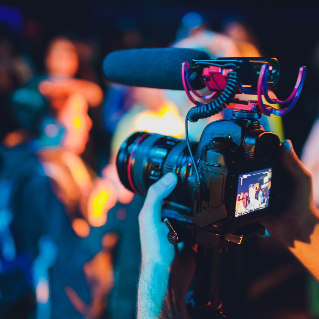 Miami Community Views A person is holding a camera with a microphone attached to it