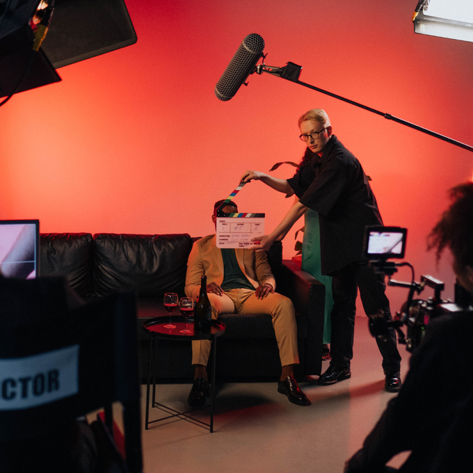 Miami Community Views A man sitting on a couch is being filmed by a director